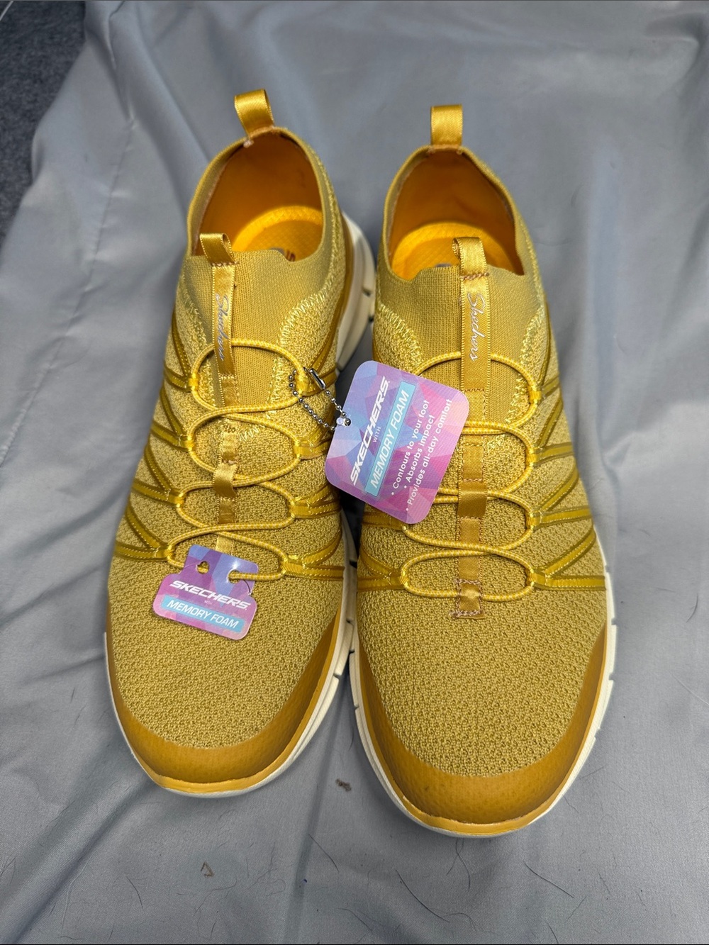 Skechers Women's Slip-On Sneakers in Mustard Yellow